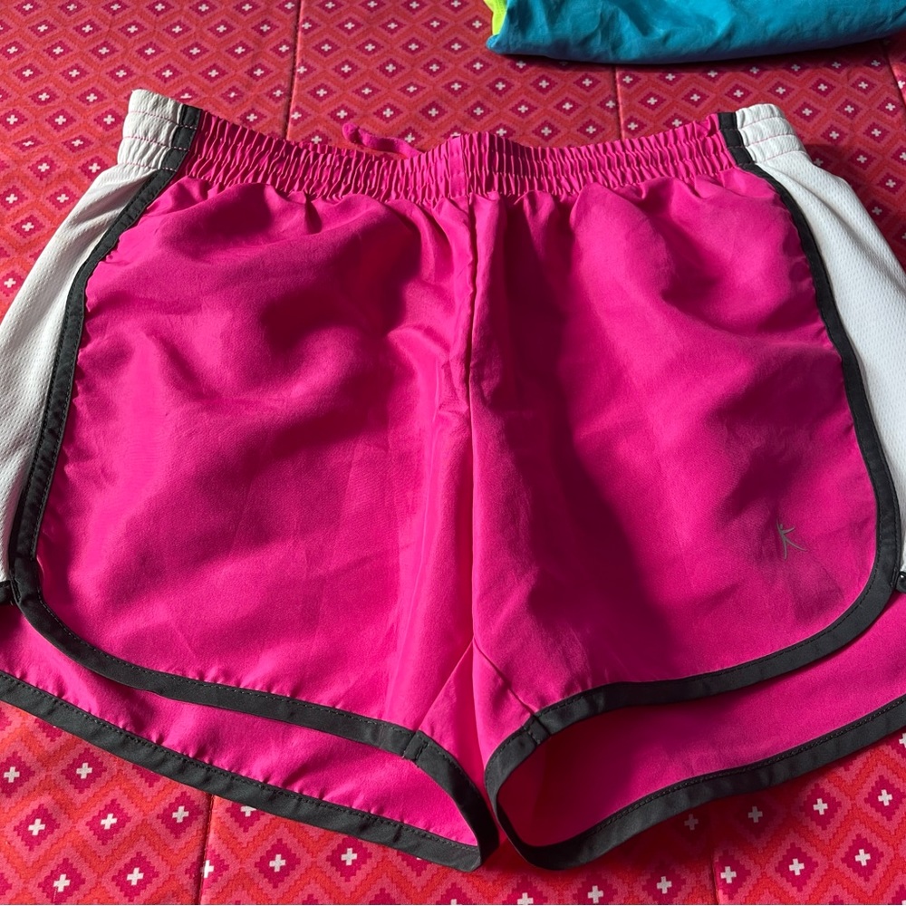 Shorts are pink,black and white.The brand is Danskin now .